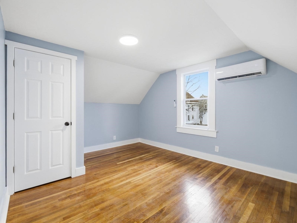 12 Howard Street Lynn, MA 01902 - Photo 11 of 26 a view of empty room with wooden floor and fan