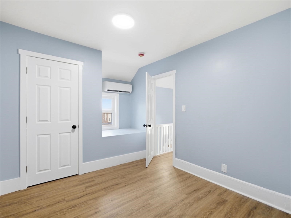 12 Howard Street Lynn, MA 01902 - Photo 12 of 26 wooden floor in an empty room