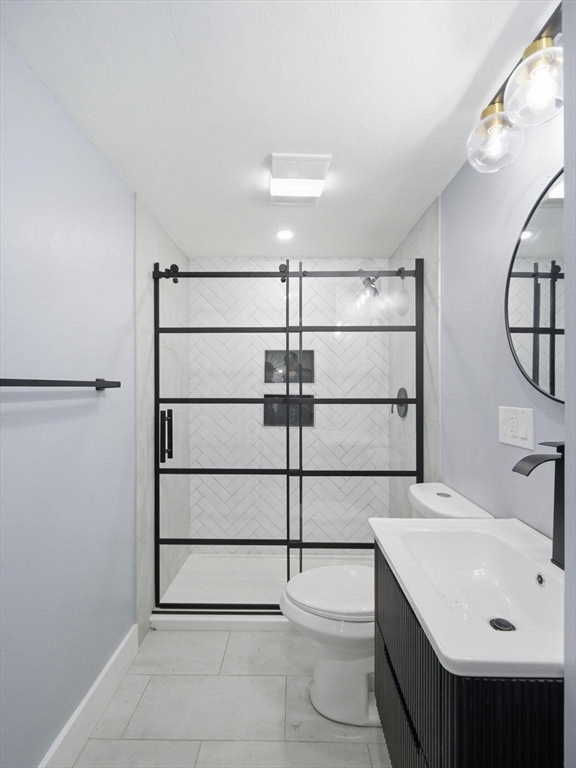 12 Howard Street Lynn, MA 01902 - Photo 14 of 26 a bathroom with a sink and mirror