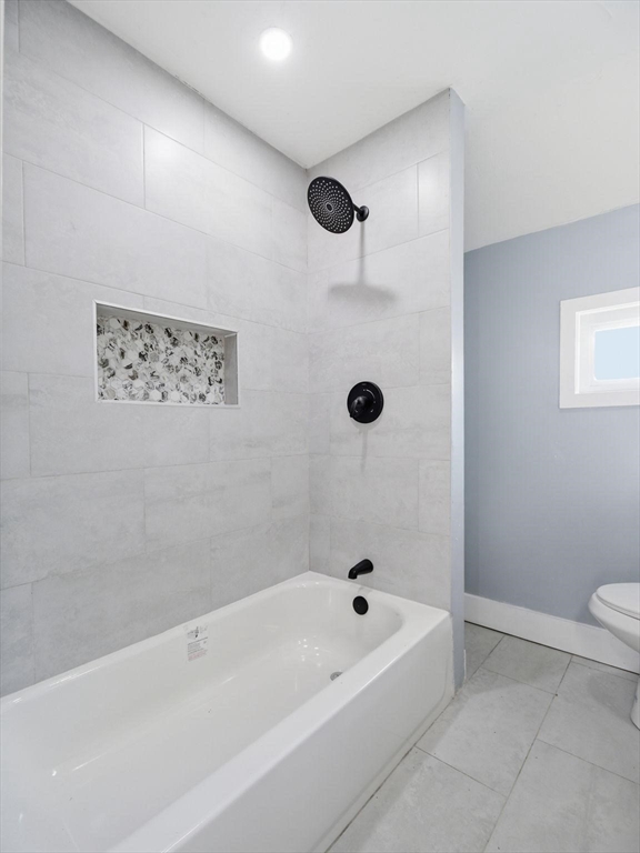 12 Howard Street Lynn, MA 01902 - Photo 17 of 26 a bathroom with a bathtub and a shower