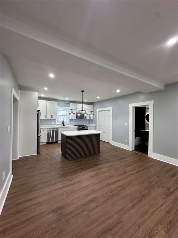 12 Howard Street Lynn, MA 01902 - Photo 4 of 26 a view of kitchen with wooden floor