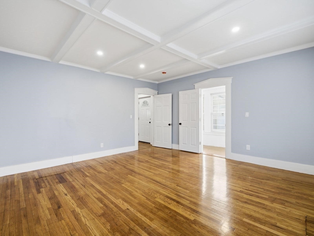 12 Howard Street Lynn, MA 01902 - Photo 9 of 26 a view of an empty room with wooden floor