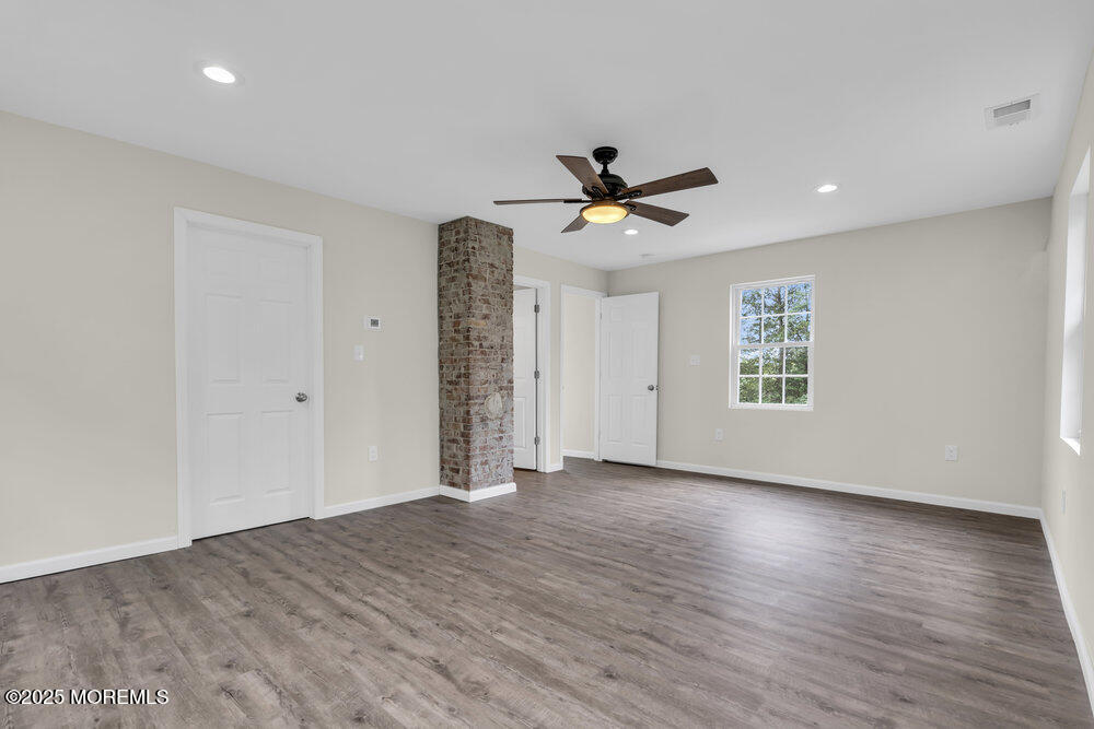 393 North County Line Road Jackson, NJ 08527 - Photo 20 of 21 a view of empty room with wooden floor and fan