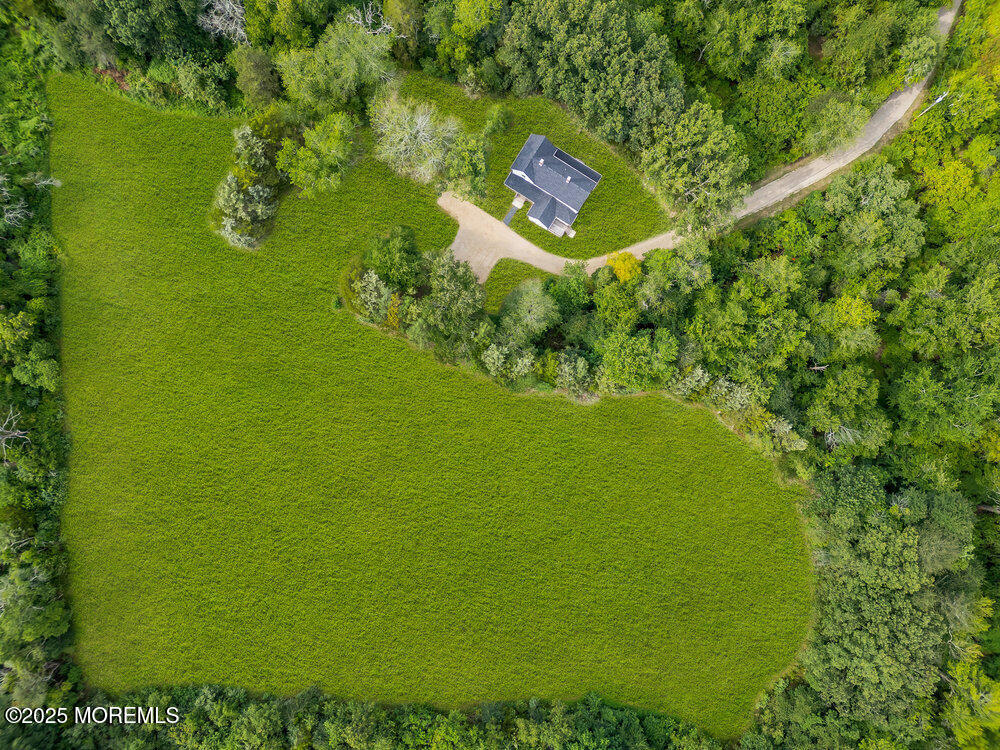 393 North County Line Road Jackson, NJ 08527 - Photo 2 of 21 a sign of golf club on a wall under a tree
