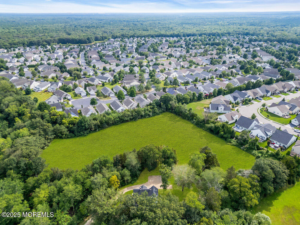 393 North County Line Road Jackson, NJ 08527 - Photo 4 of 21 an aerial view of a residential houses with outdoor space and lake view