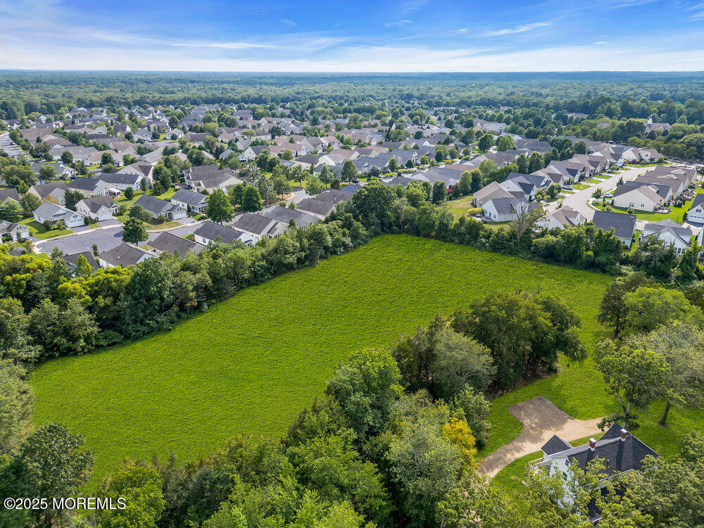 393 North County Line Road Jackson, NJ 08527 - Photo 5 of 21 an aerial view of residential houses with outdoor space and trees