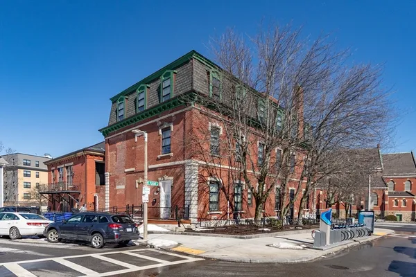 a front view of a building with street view