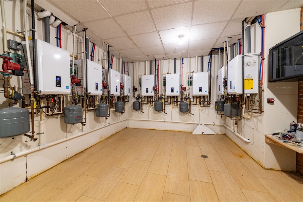 409 Dudley Street Boston, MA 02119 - Photo 12 of 16 a swimming pool with outdoor seating and yard