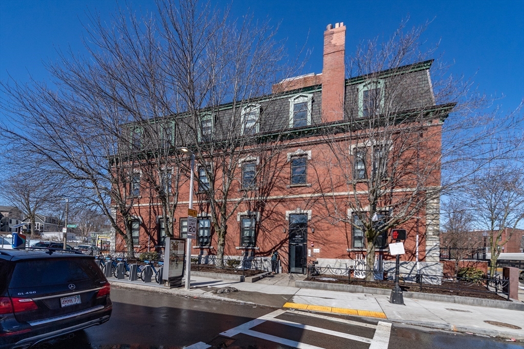 409 Dudley Street Boston, MA 02119 - Photo 2 of 16 a car parked on the side of a street