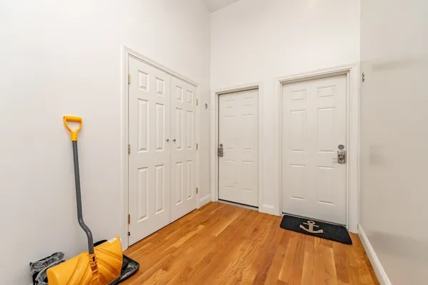 a view of a room with wooden floor
