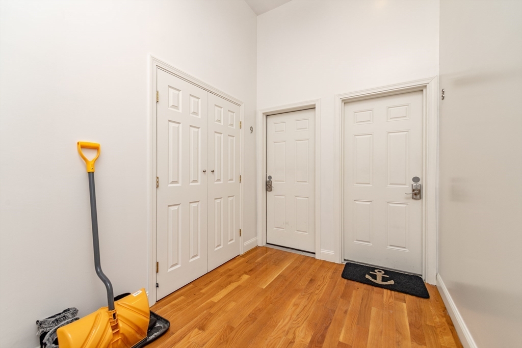 409 Dudley Street Boston, MA 02119 - Photo 5 of 16 a view of a room with wooden floor