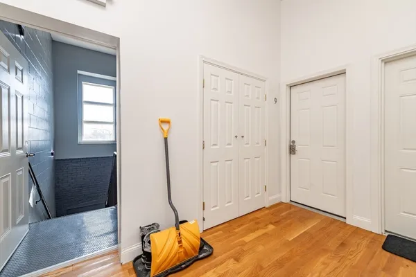 a view of a room with wooden floor and cabinet