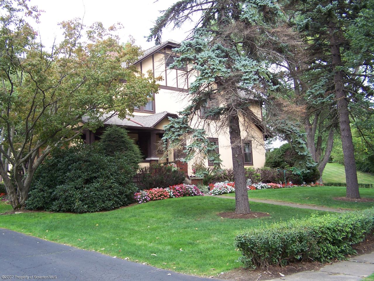 407 Nelson Street Clarks Summit, PA 18411 - Photo 2 of 3 a front view of a house with garden