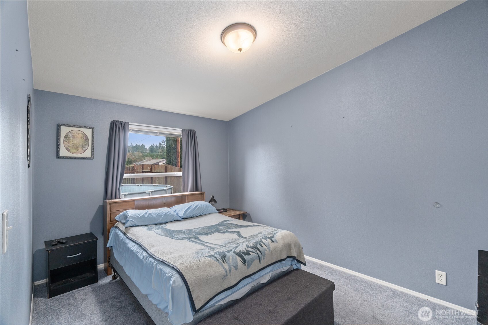 1614 West Martin Street Elma, WA 98541 - Photo 13 of 38 a bedroom with a bed and a window