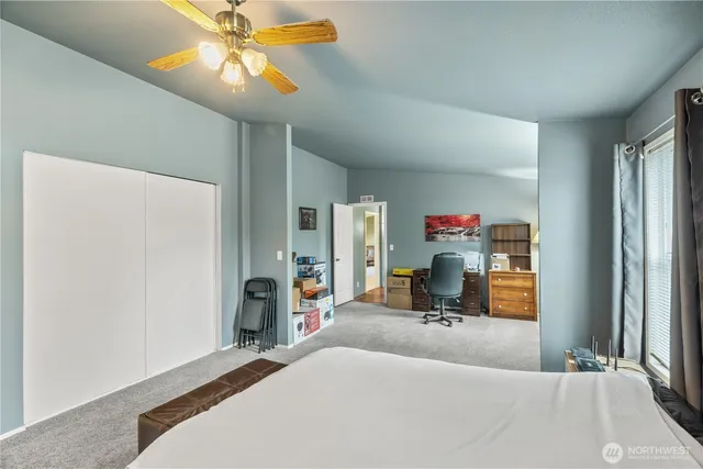 a room with a bed and a chandelier