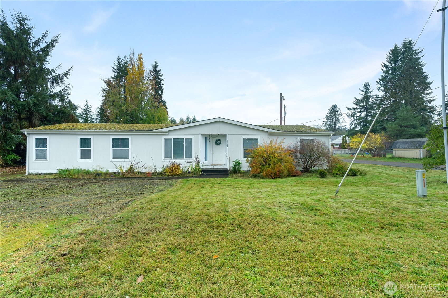 1614 West Martin Street Elma, WA 98541 - Photo 2 of 38 a view of a house with a backyard