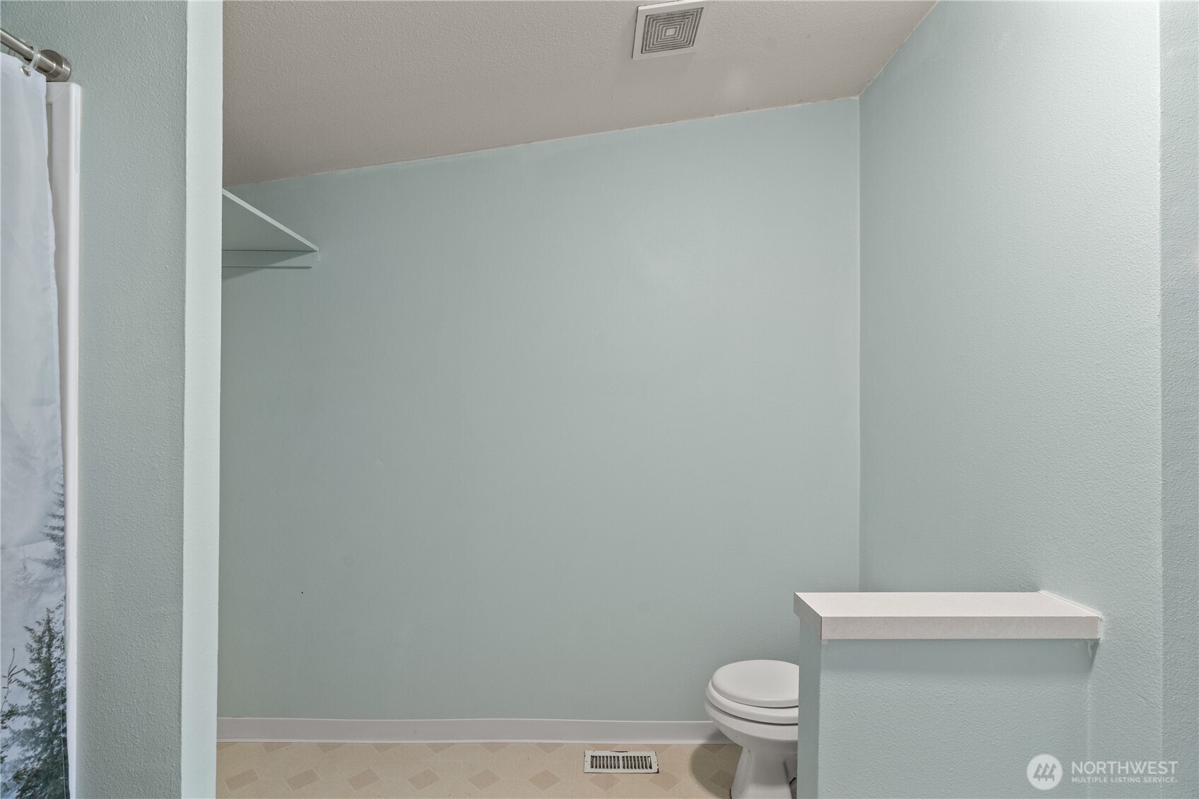 1614 West Martin Street Elma, WA 98541 - Photo 21 of 37 a white toilet sitting next to a shower