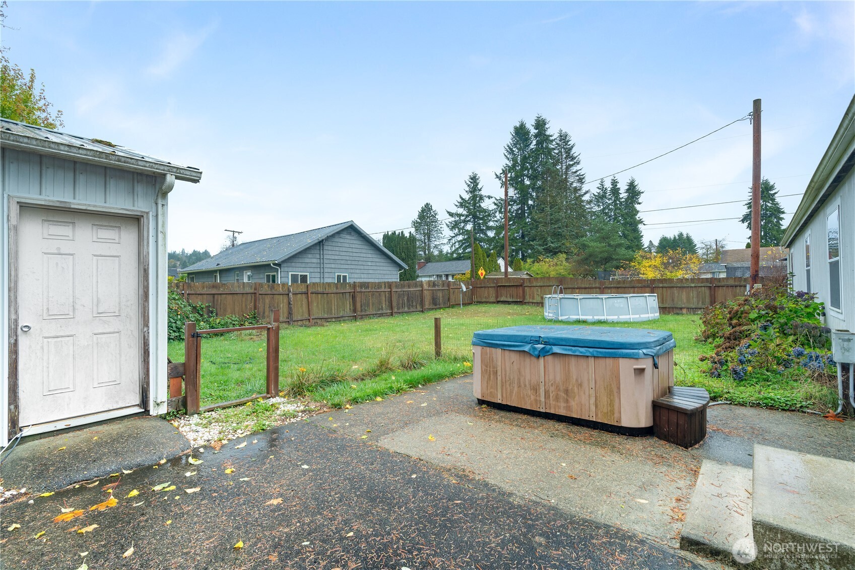 1614 West Martin Street Elma, WA 98541 - Photo 26 of 37 a backyard of a house with outdoor seating and green space