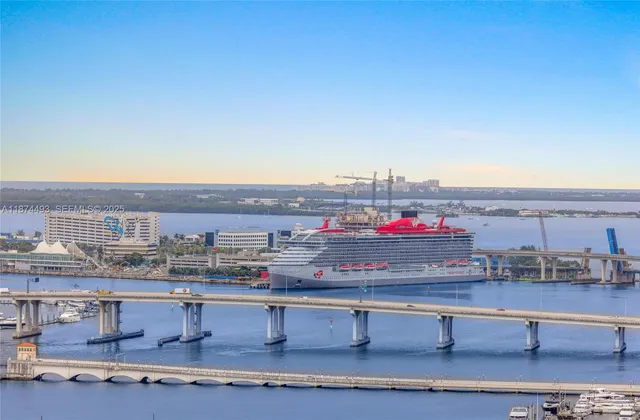 a view of a patio with a table and chairs under an umbrella