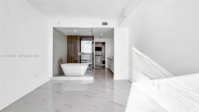 a view of front door with wooden floor