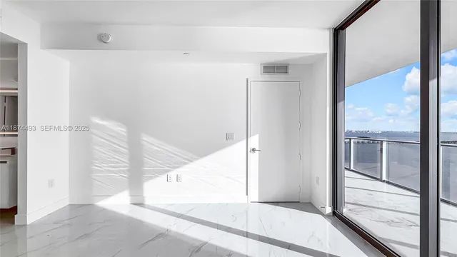 a view of a lake with tall building next to a lake