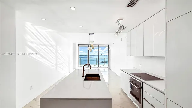 a view of a lake with houses in the back