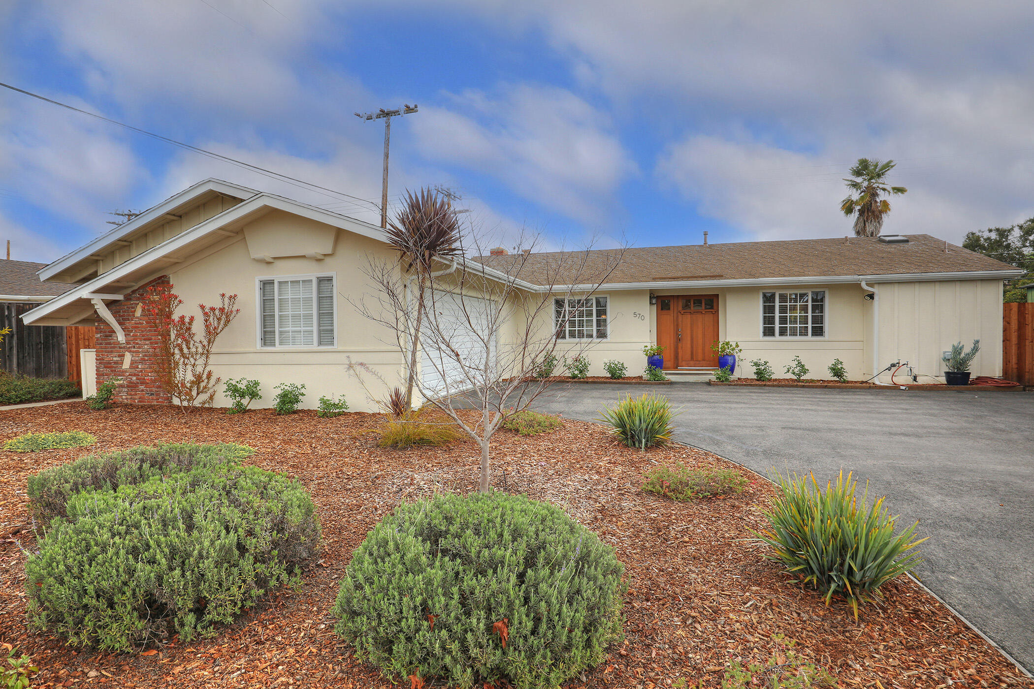 a front view of a house with garden