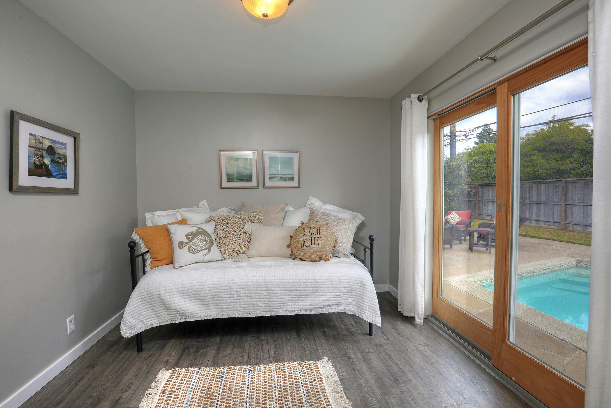 570 Amherst Drive Goleta, CA 93117 - Photo 12 of 31 a bedroom with a bed and a wooden floor