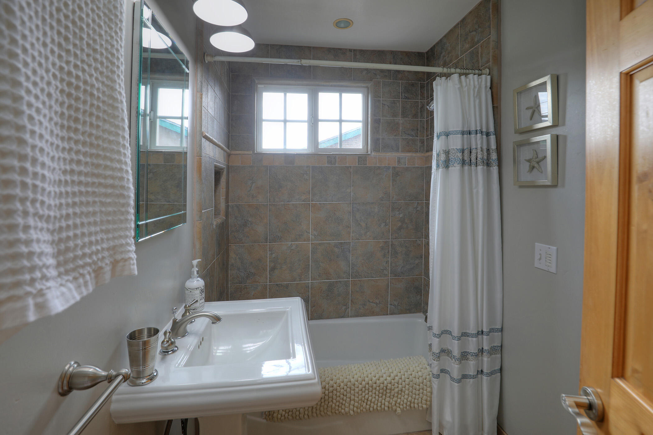 570 Amherst Drive Goleta, CA 93117 - Photo 16 of 31 a bathroom with a sink and a mirror