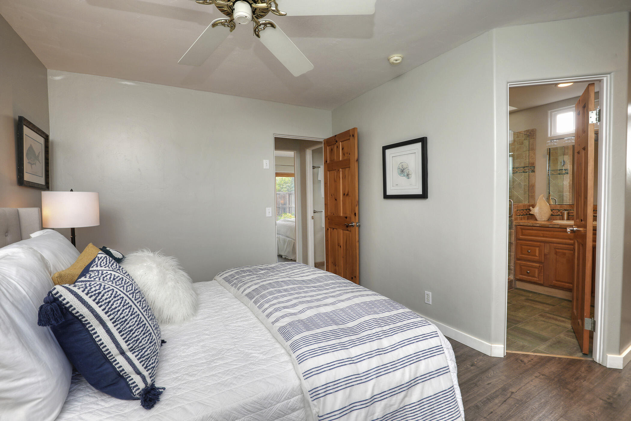570 Amherst Drive Goleta, CA 93117 - Photo 19 of 31 a bedroom with a bed and a chandelier