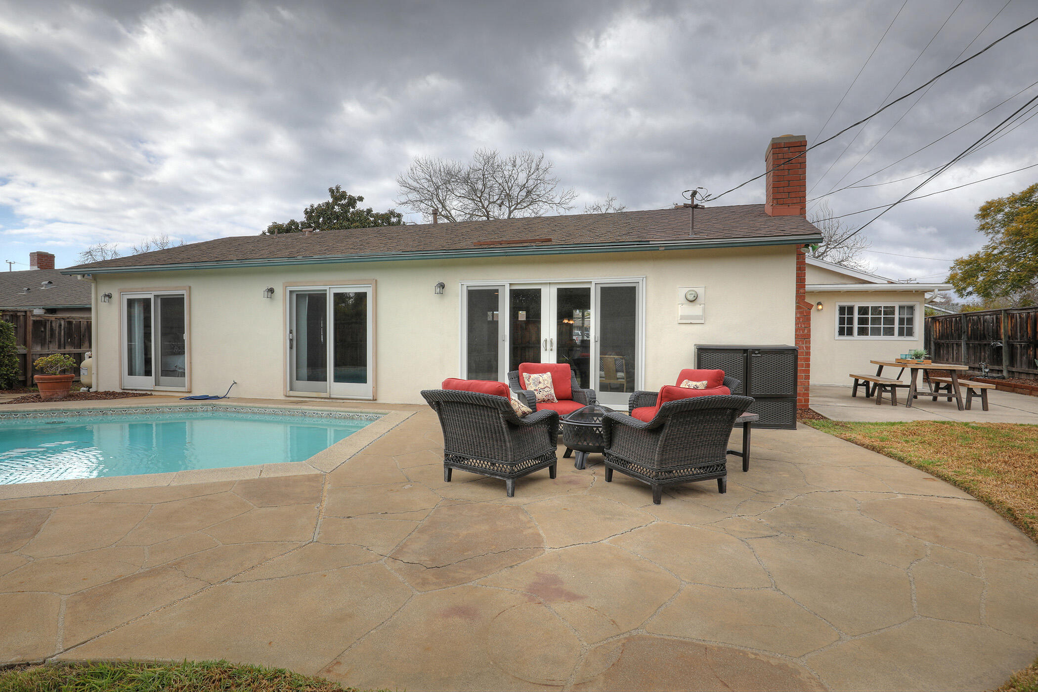 570 Amherst Drive Goleta, CA 93117 - Photo 26 of 31 a view of a house with a patio and a yard