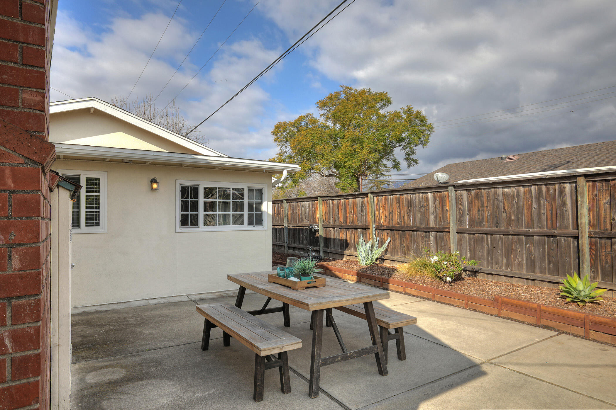 570 Amherst Drive Goleta, CA 93117 - Photo 27 of 31 a backyard of a house with table and chairs