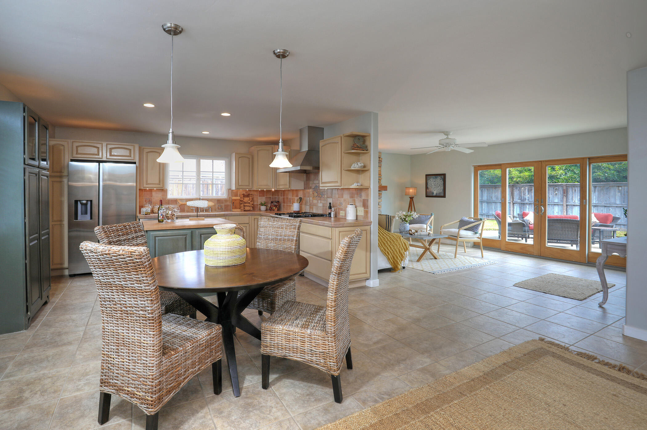 570 Amherst Drive Goleta, CA 93117 - Photo 5 of 31 a dining hall with stainless steel appliances kitchen island granite countertop a table chairs and a living room view