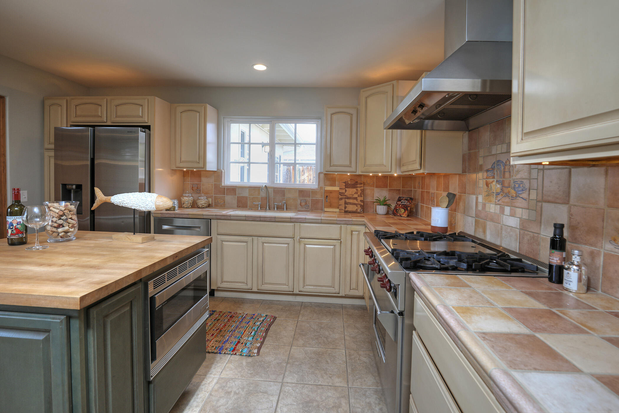 570 Amherst Drive Goleta, CA 93117 - Photo 9 of 31 a kitchen with a sink stove top oven and cabinets