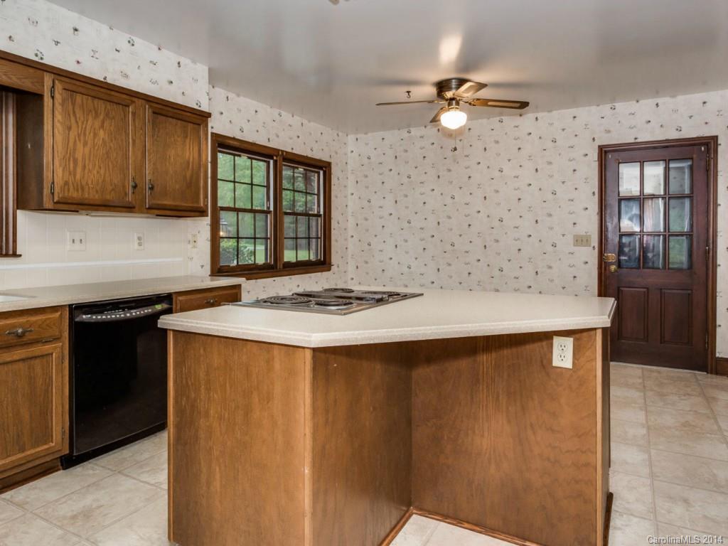 409 Whitestone Road Charlotte, NC 28270 - Photo 11 of 18 a kitchen with stainless steel appliances a sink and cabinets