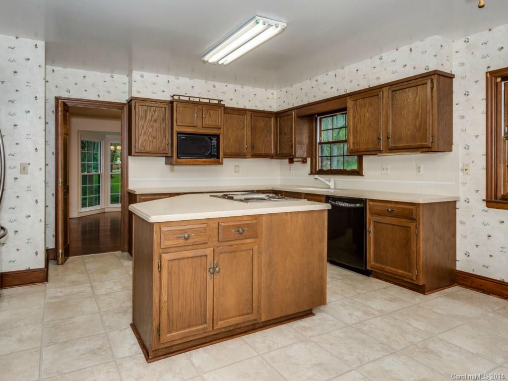 409 Whitestone Road Charlotte, NC 28270 - Photo 13 of 18 a kitchen with stainless steel appliances granite countertop a stove a sink and a microwave