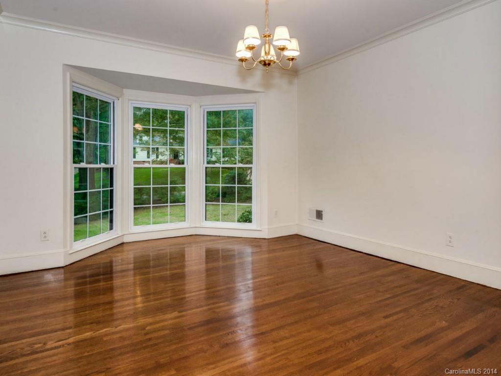 409 Whitestone Road Charlotte, NC 28270 - Photo 4 of 18 a view of empty room with wooden floor and fan