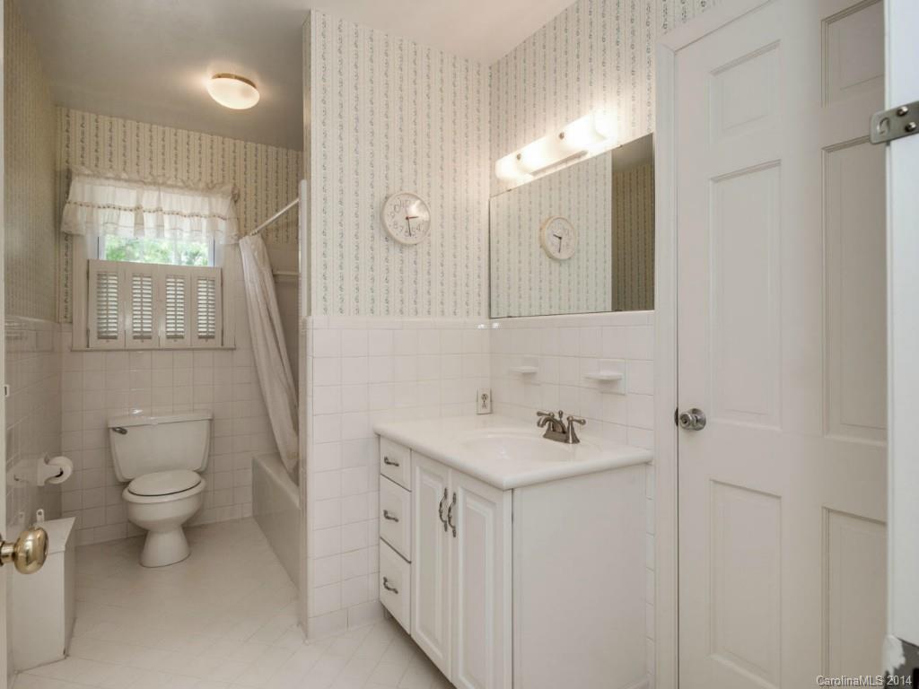 409 Whitestone Road Charlotte, NC 28270 - Photo 9 of 18 a bathroom with a sink toilet and mirror
