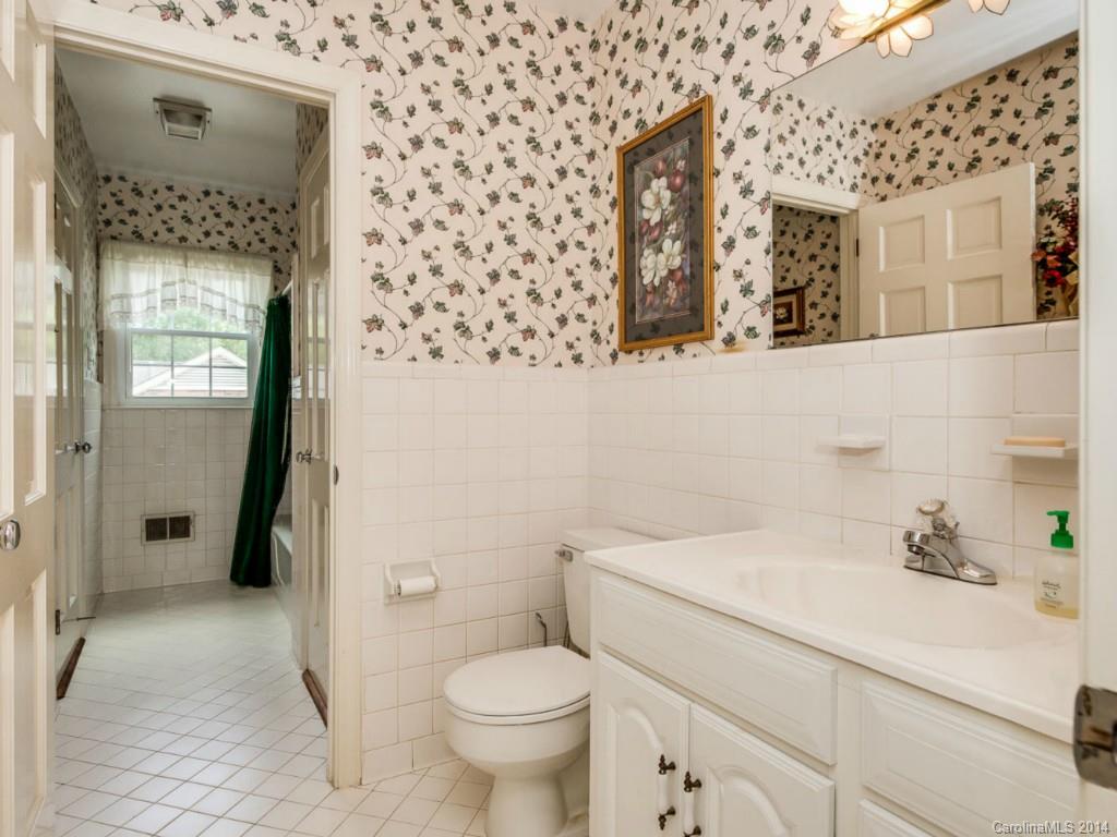 409 Whitestone Road Charlotte, NC 28270 - Photo 10 of 18 a bathroom with a sink a toilet and shower
