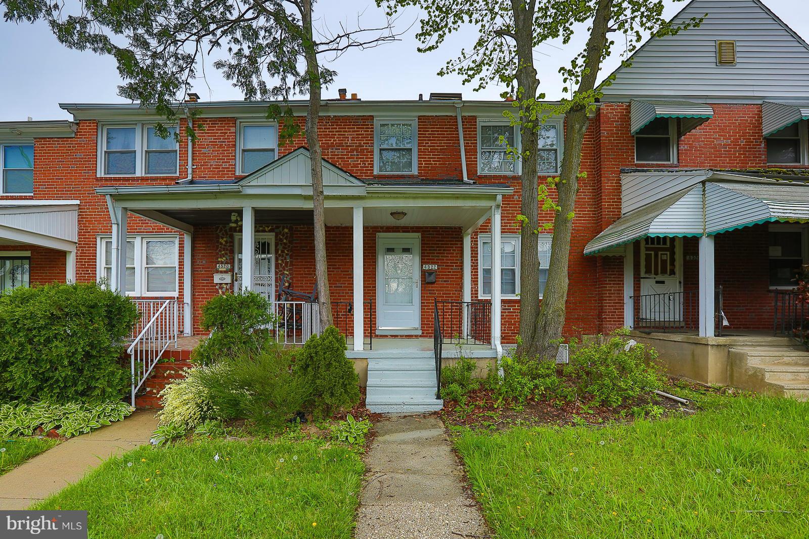4522 Marble Hall Road Baltimore, MD 21239 - Photo 1 of 28 a front view of a house with garden