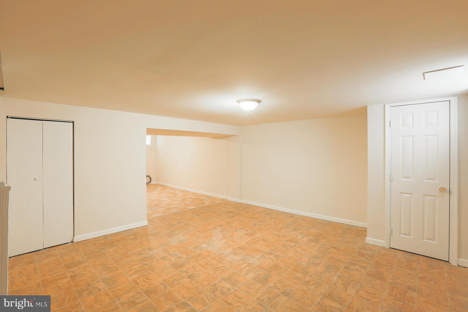 4522 Marble Hall Road Baltimore, MD 21239 - Photo 22 of 28 an empty room with an entryway