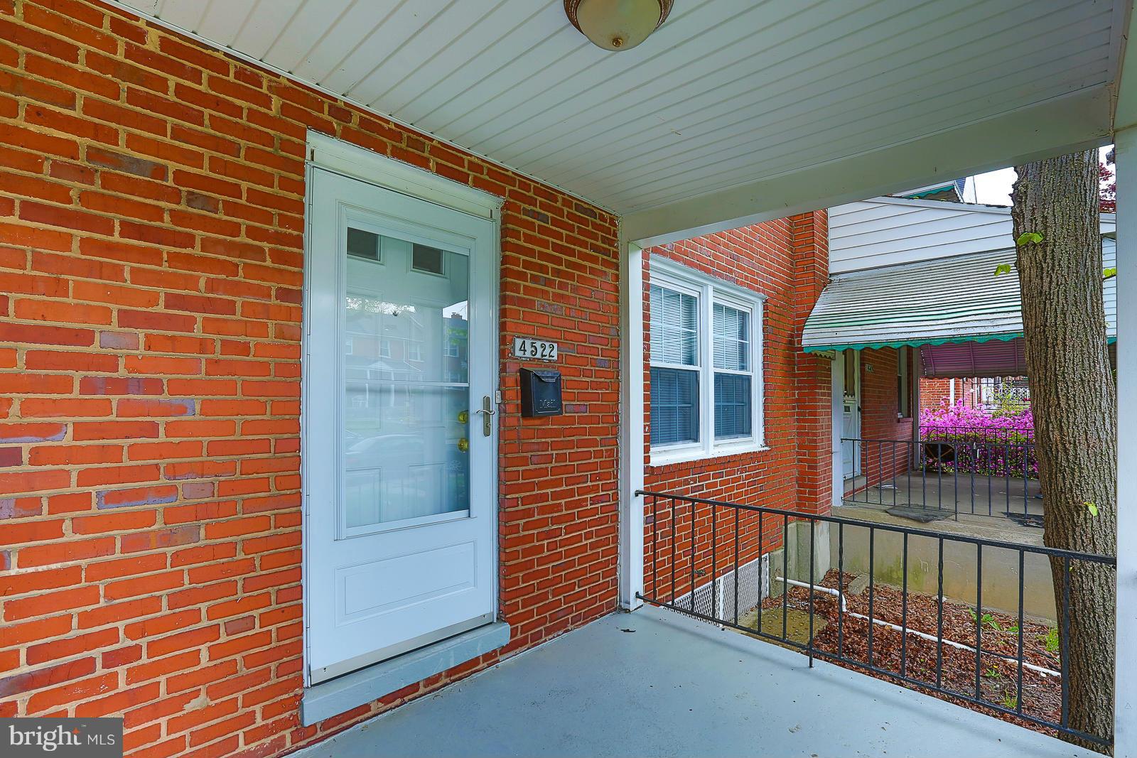 4522 Marble Hall Road Baltimore, MD 21239 - Photo 4 of 28 a view of a brick house with a large window