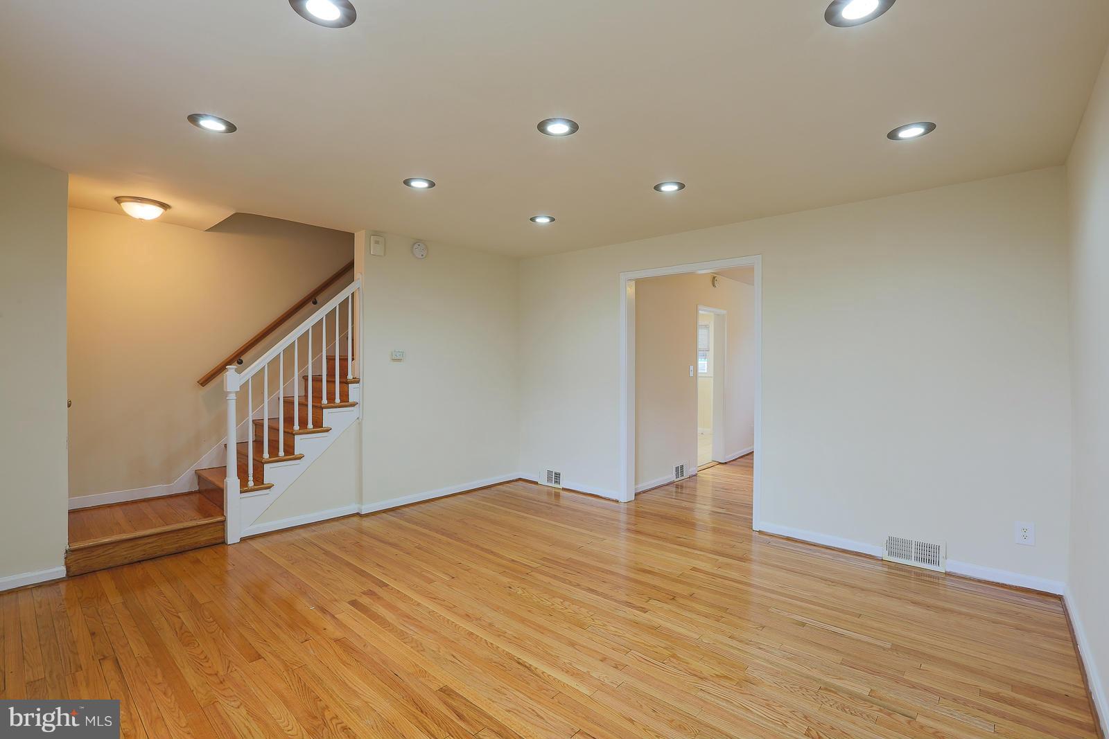 4522 Marble Hall Road Baltimore, MD 21239 - Photo 6 of 28 a view of an empty room with wooden floor