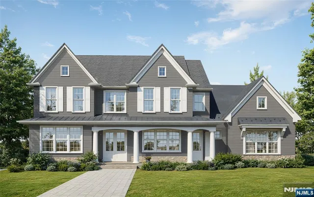 front view of a house next to a yard