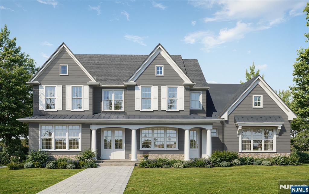 front view of a house next to a yard