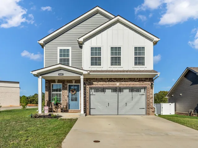 a front view of a house with a yard and porch