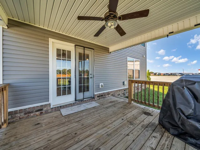 a view of a balcony with a sink and wooden floor