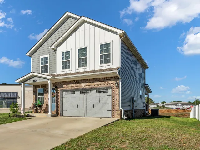 a front view of a house with a yard