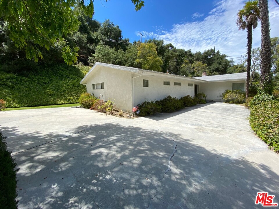 9748 Oak Pass Road Beverly Hills, CA 90210 - Photo 2 of 20 a view of outdoor space and yard