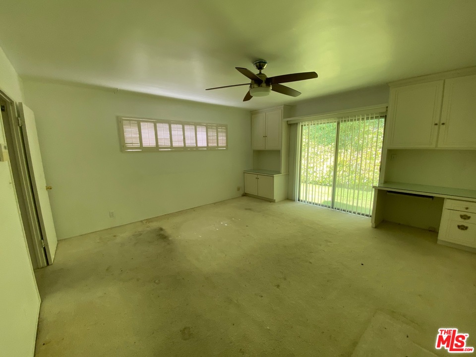 9748 Oak Pass Road Beverly Hills, CA 90210 - Photo 13 of 20 a view of an empty room with a window